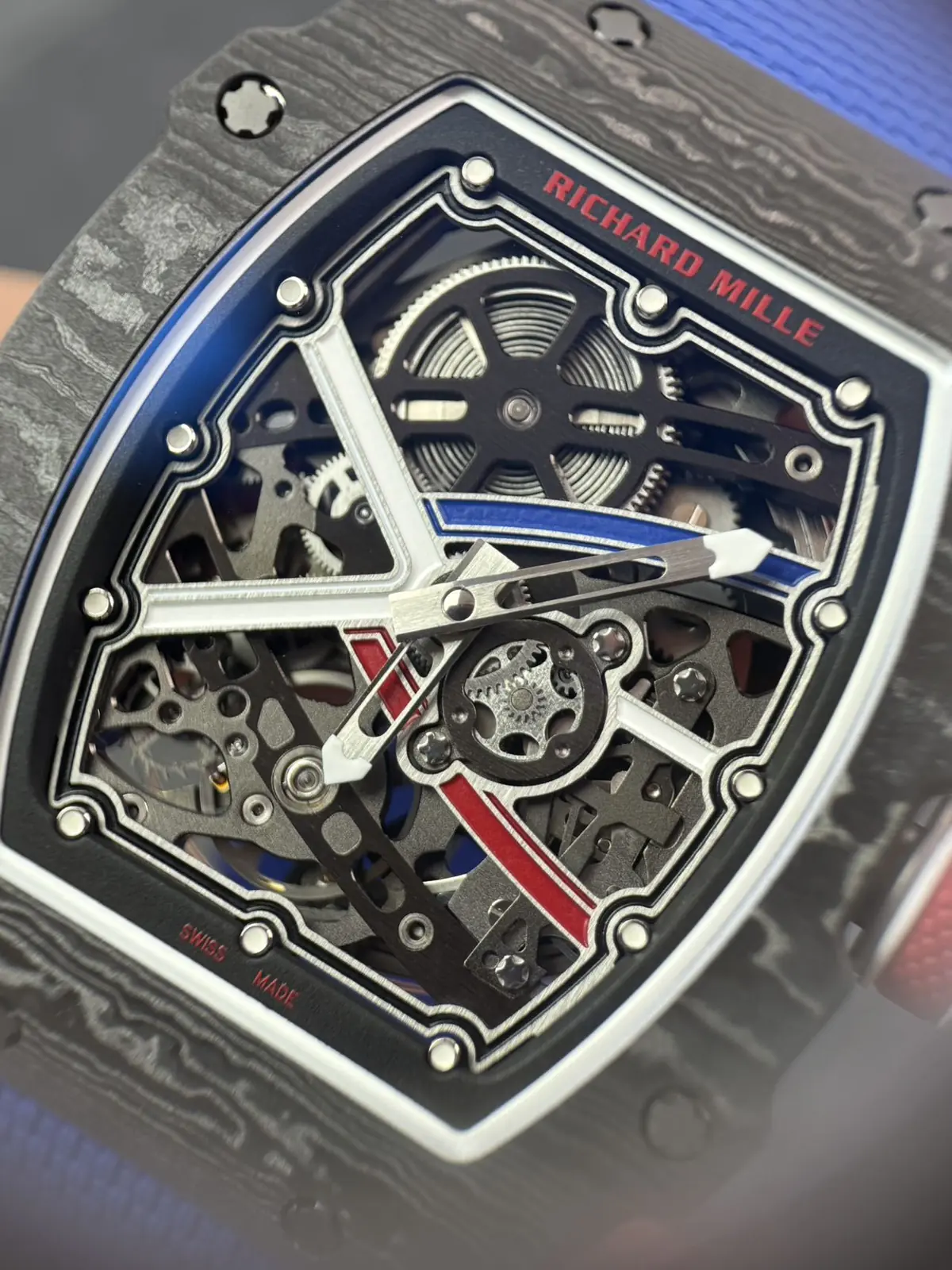 Macro of the RM 67-02 skeleton dial with blue and red accents