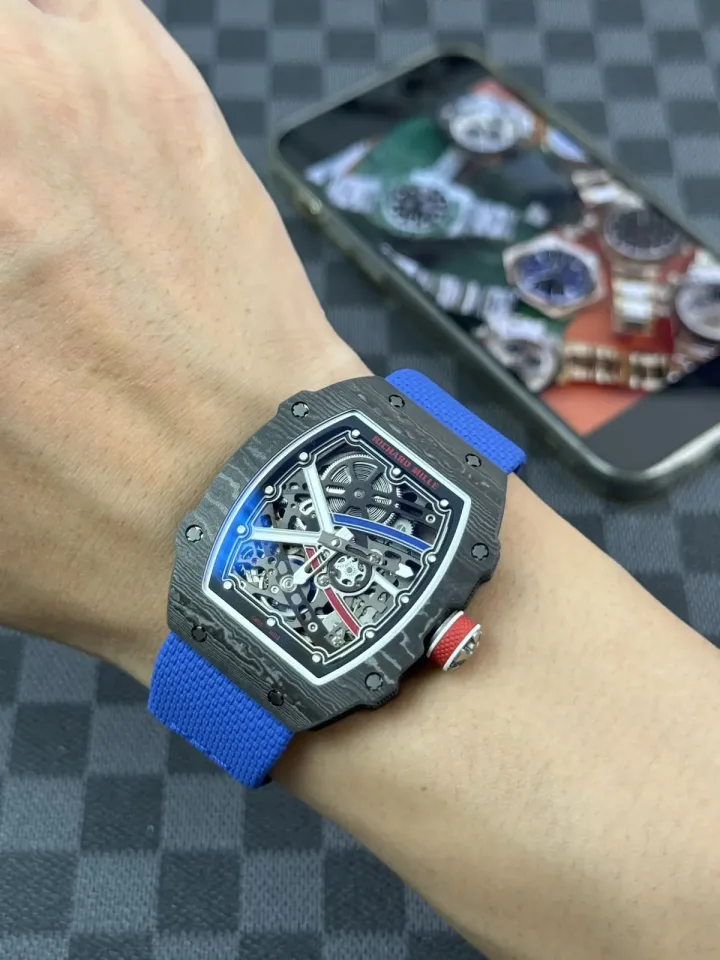 RM 67-02 worn on the wrist with blue strap